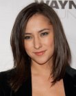 Brunette Zelda Williams with her straight hair cut just below the shoulders