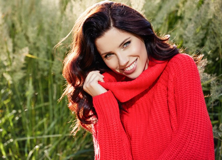 woman wearing a cosy red cowl neck sweater