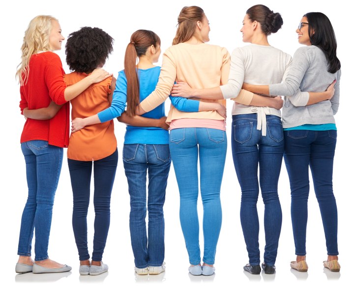 Back view of women wearing jeans