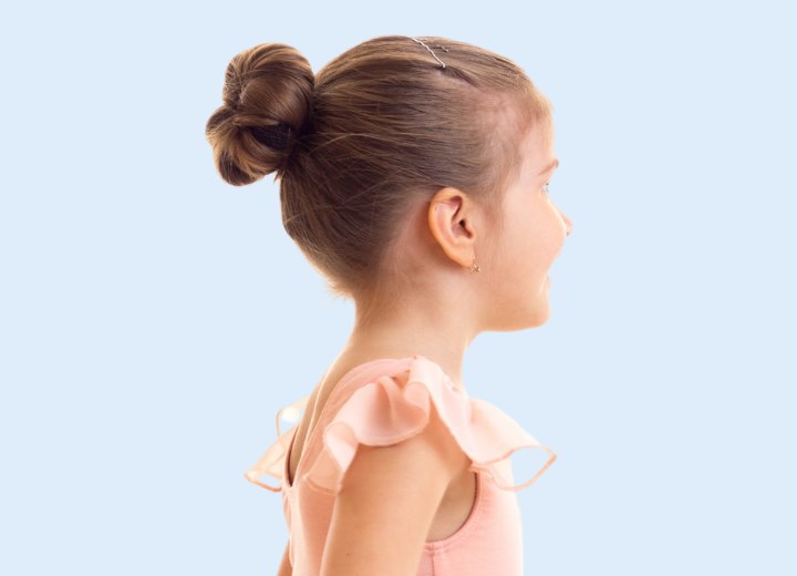 Ballerina girl with her hair styled into a bun