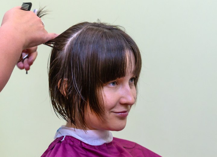 Haidresser cutting a bob with layers