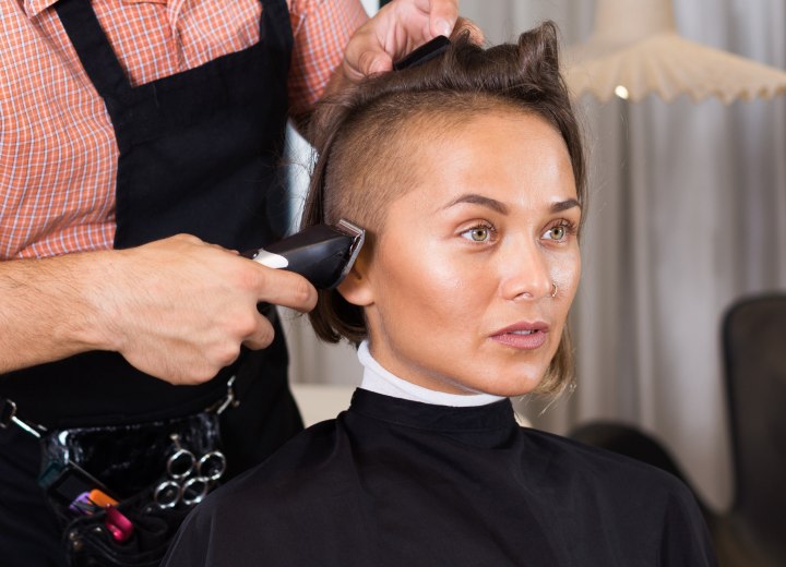 Clipper cutting female hair