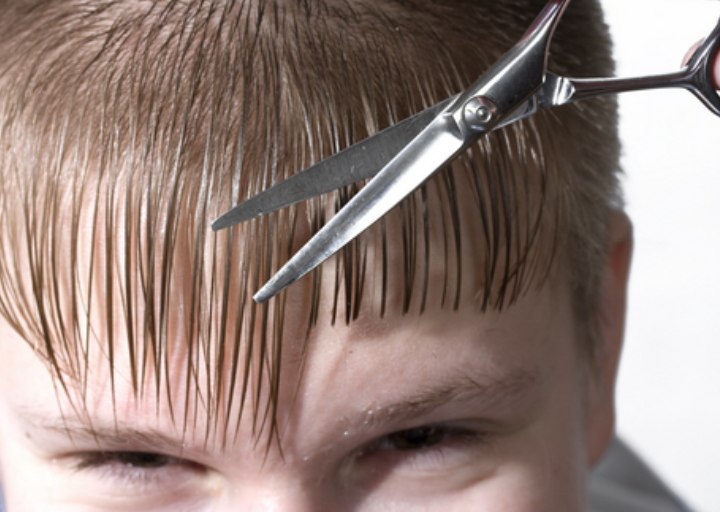 Cutting the hair of a boy