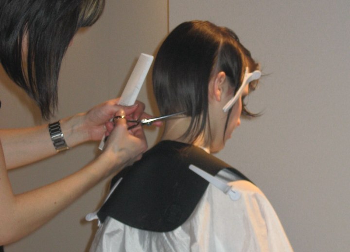Hair stylist cutting hair on stage