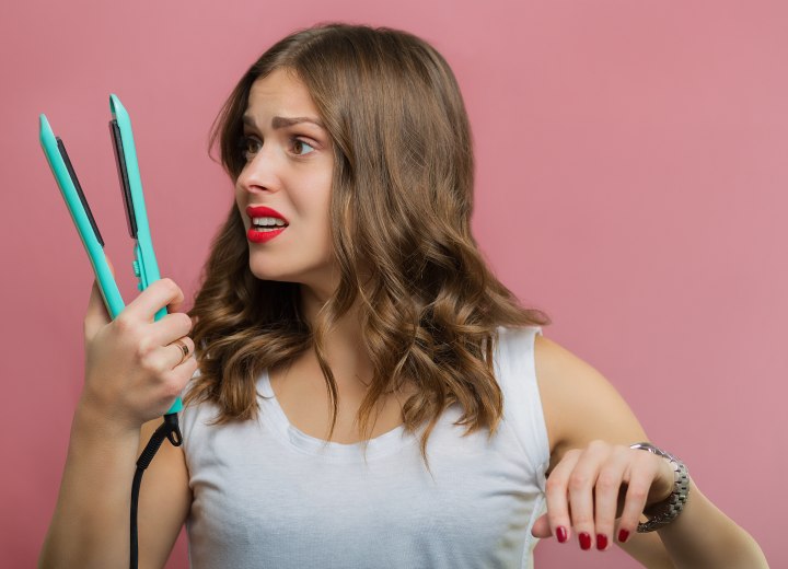 Woman with a flat iron hair problem