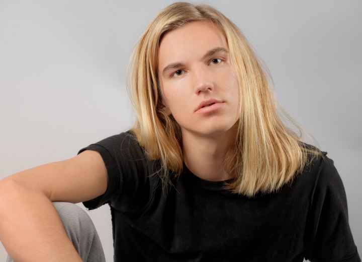 Young man with long blonde hair