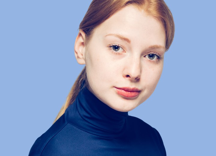 Woman with oily hair wearing a silky turtleneck