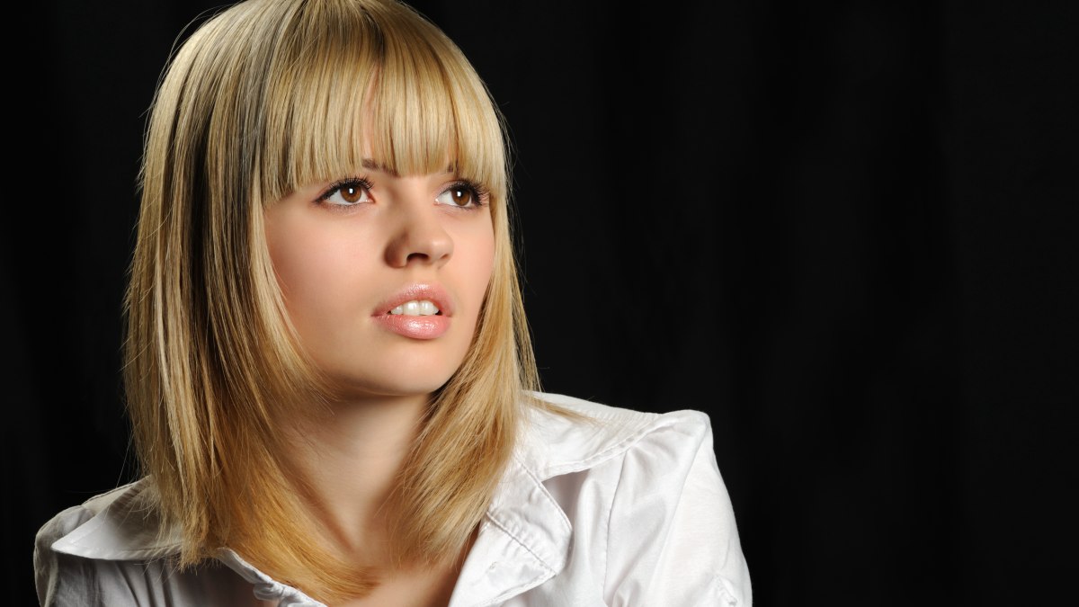 Image of Long shaggy hair with a ponytail