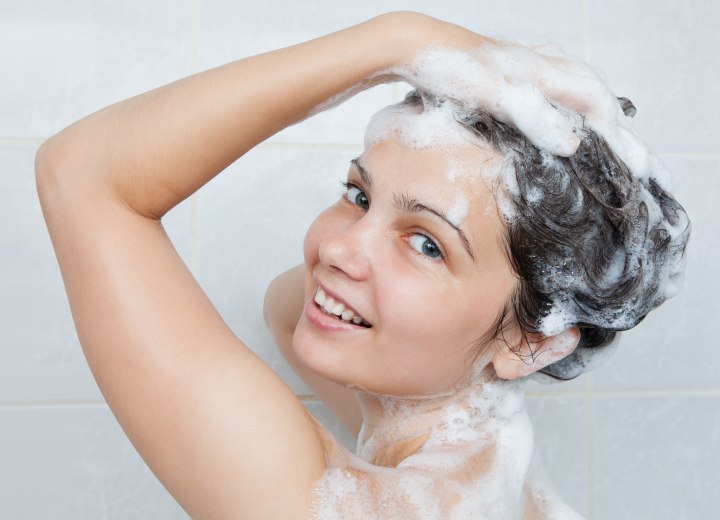 Young woman who is washing her hair