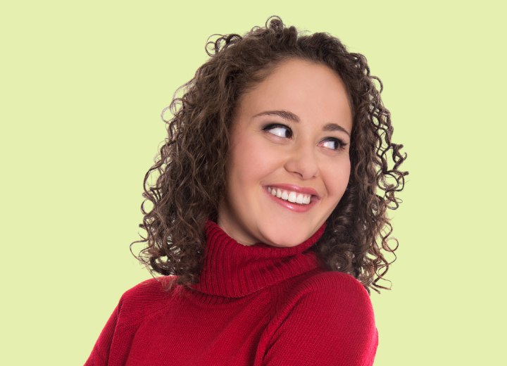 Young woman with thick brown curly hair