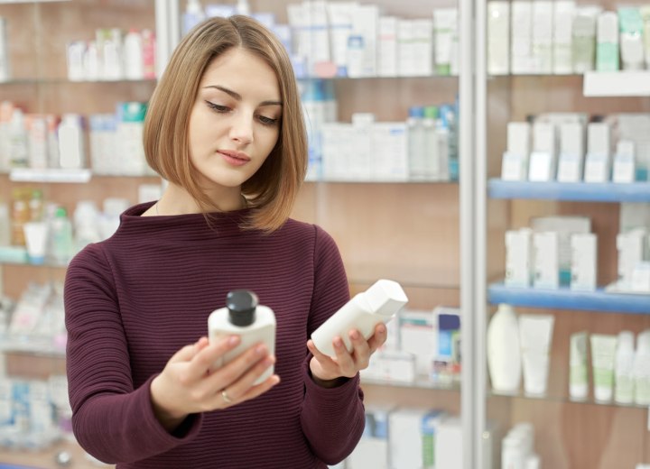 Woman who is buying clarifying shampoo for color treated hair