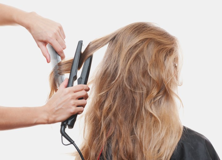 Hair straightening with a flat iron