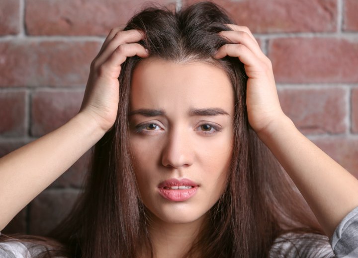 Woman with an itchy scalp