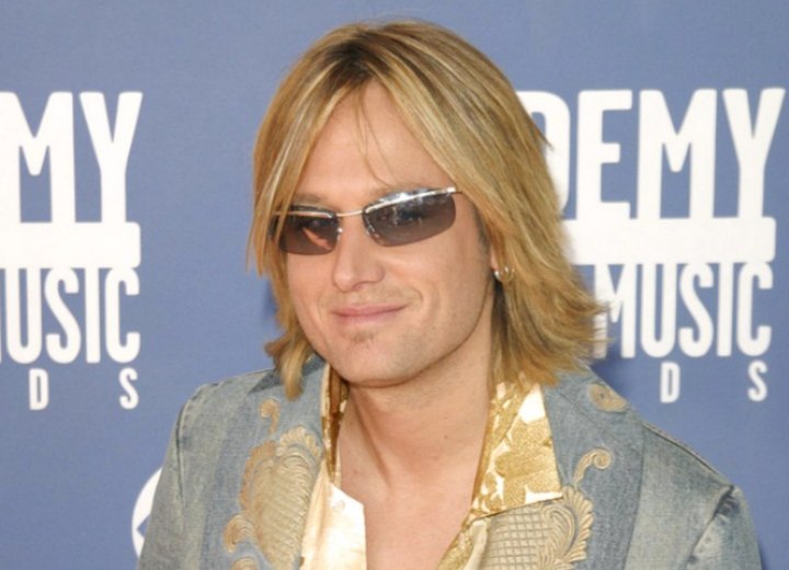 Keith Urban with long hair and sunglasses