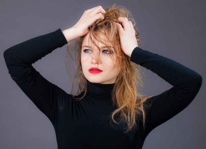 Woman with semi wet hair wearing a black turtleneck