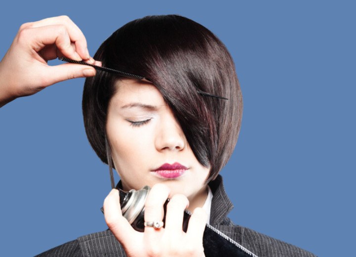 Styling short hair with comb and spray