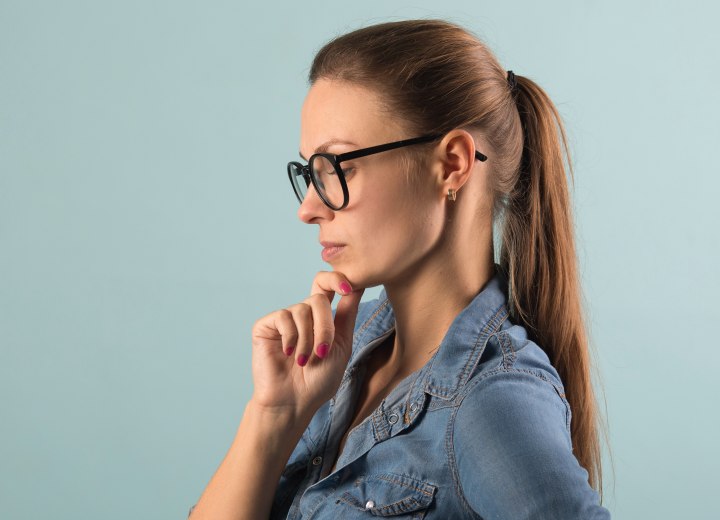 Woman wearing her hair in a tight ponytail