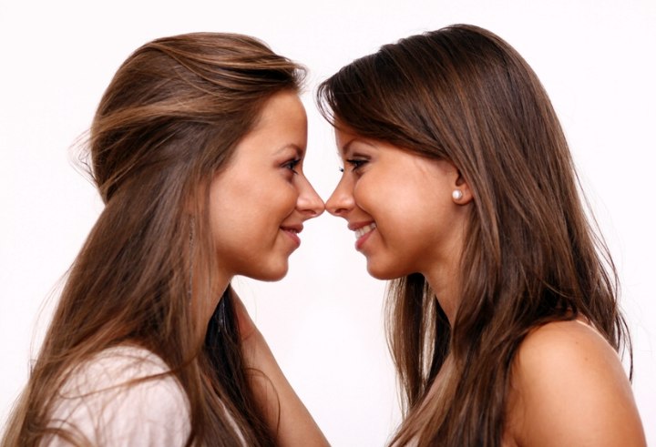 Twin girls with long hair and brown hair colors