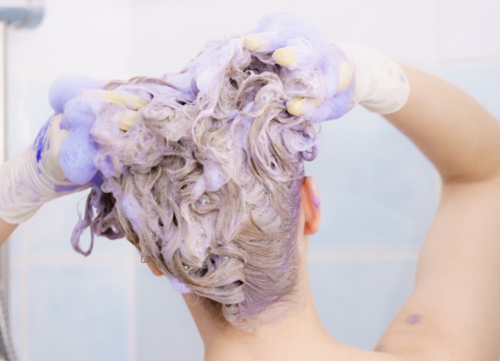 Woman washing her newly dyed hair