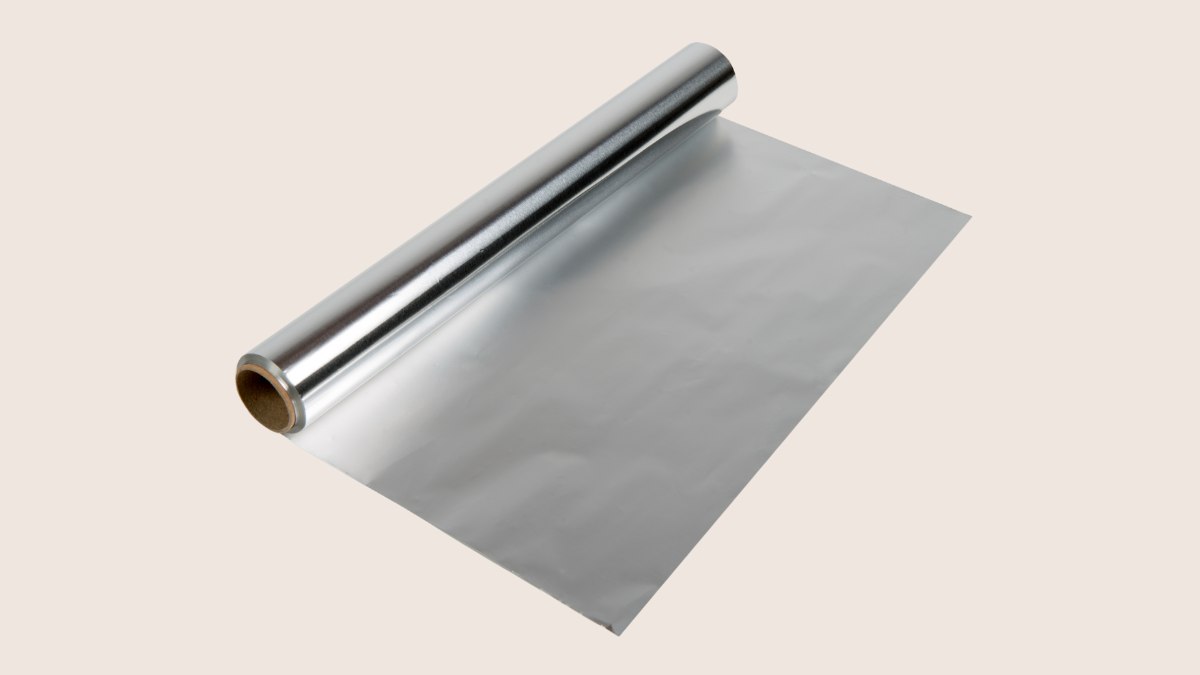 Use regular aluminium foil  for highlighting waxed paper or cellophane 