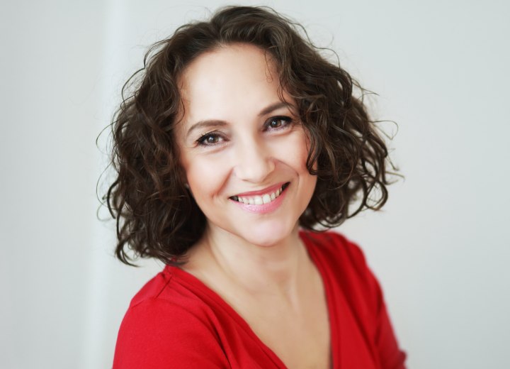 Woman with curly neck length hair