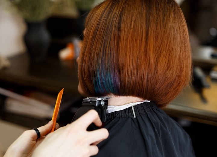 Hair stylist cutting a bob with clippers
