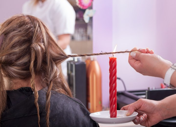 Cutting hair with a candle