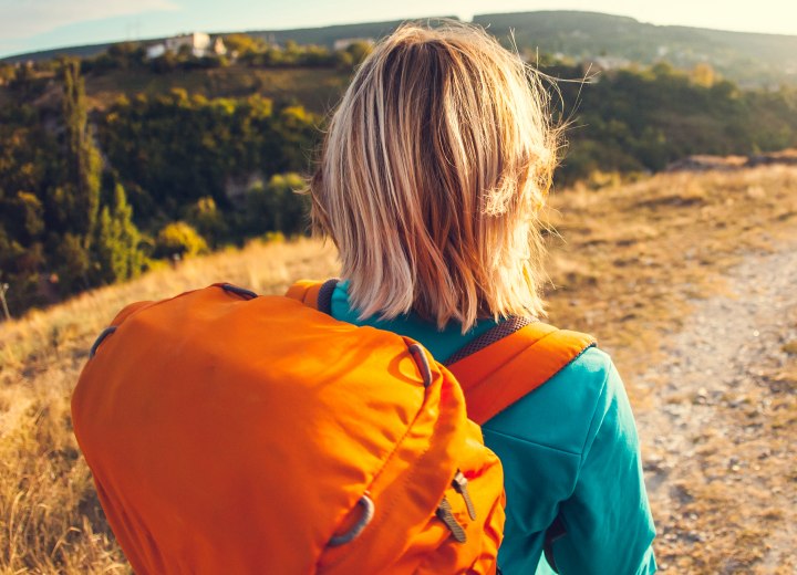 Female backpacker with shoulder-length hair