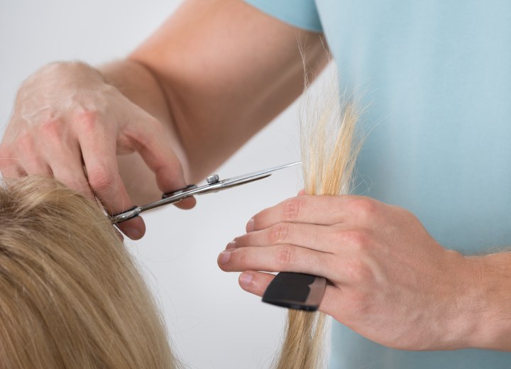 Haidresser who is chopping hair