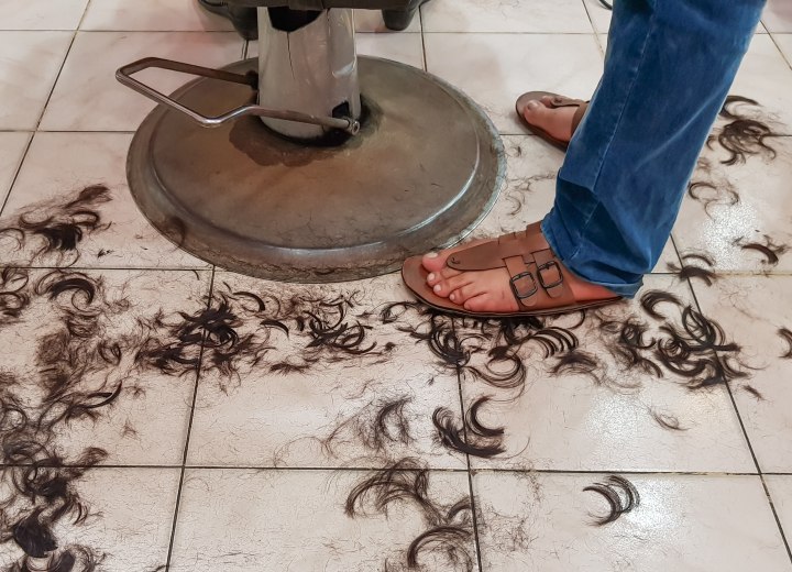 Freshly cut hair on the salon floor