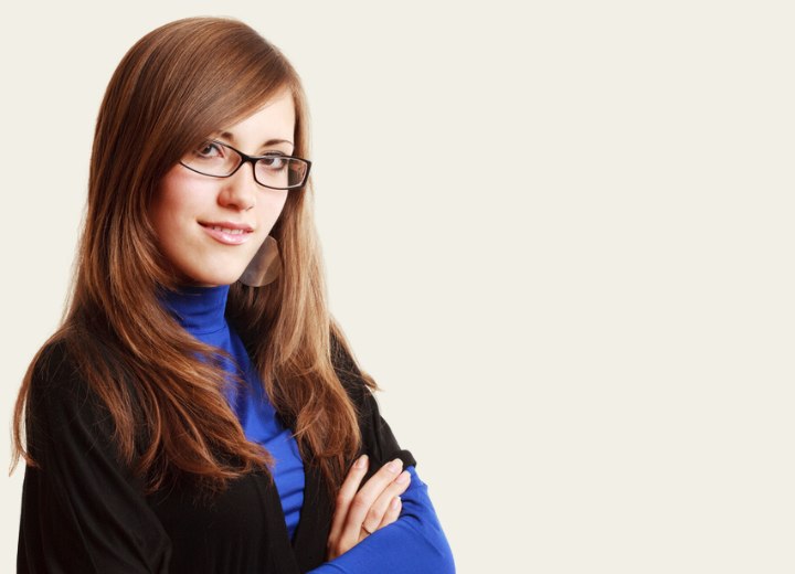 Young woman with long hair wearing glasses