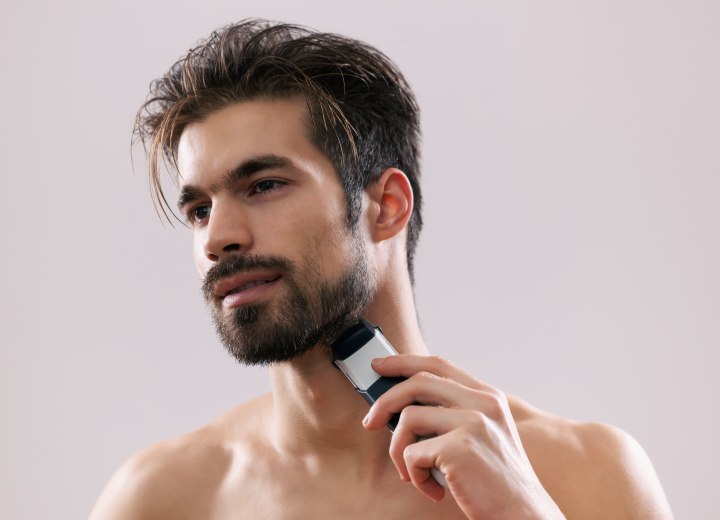 Man who is shaving his beard