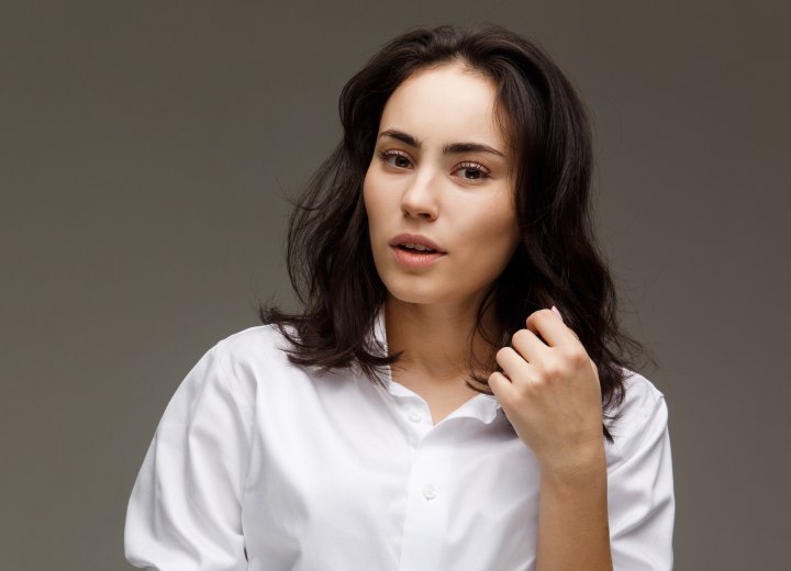 Worried woman after discovering gray hairs