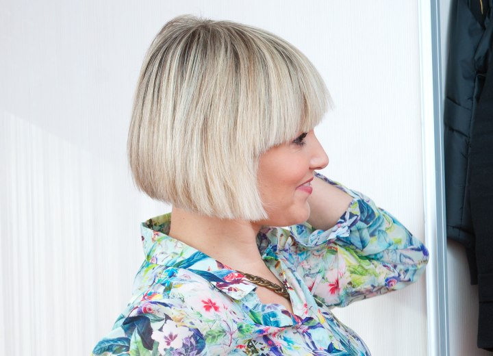 Short angled bob with bangs for blonde hair