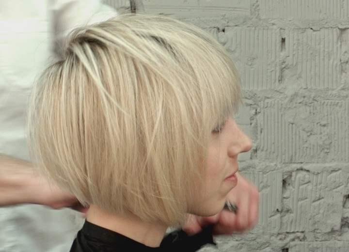 Hair stylist cutting an A-line bob with layers