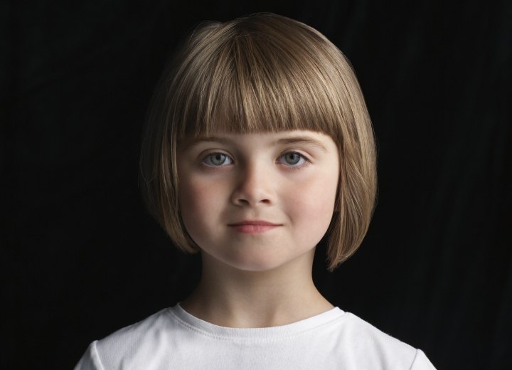 Girl with her hair cut into an uneven bob
