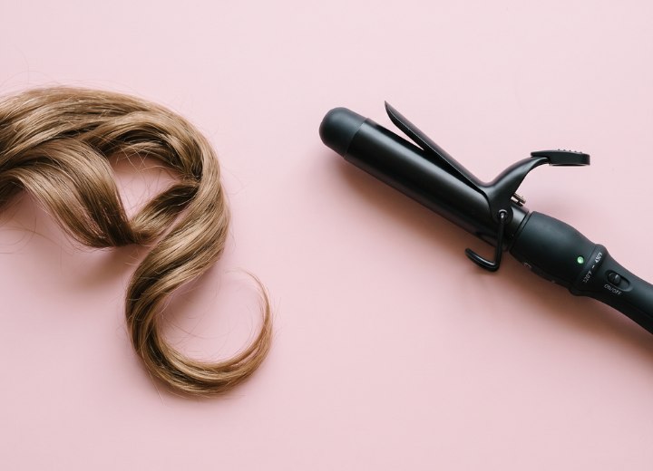 Curl hair with a curling iron