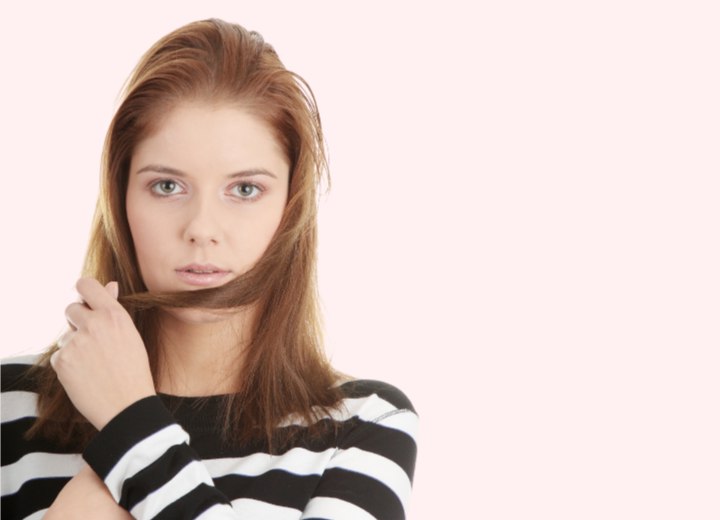 Girl using her hair to change the appearance of her face shape