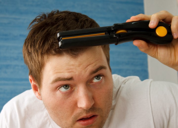 Straighten men's hair with a flat iron