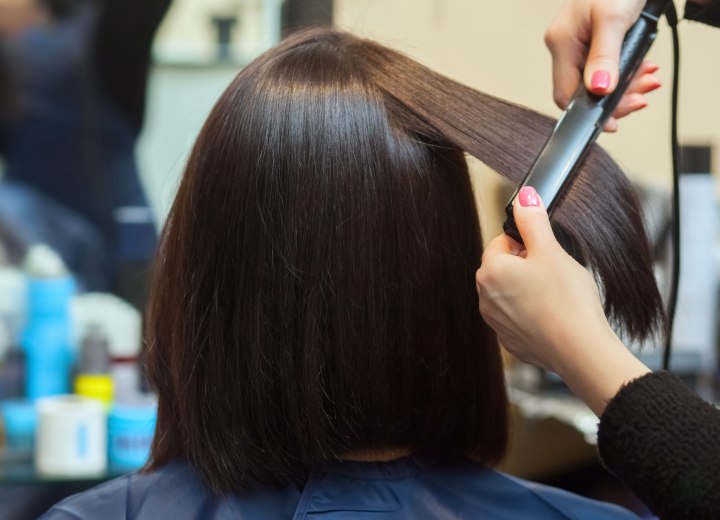 Hair heat styling with a flat iron