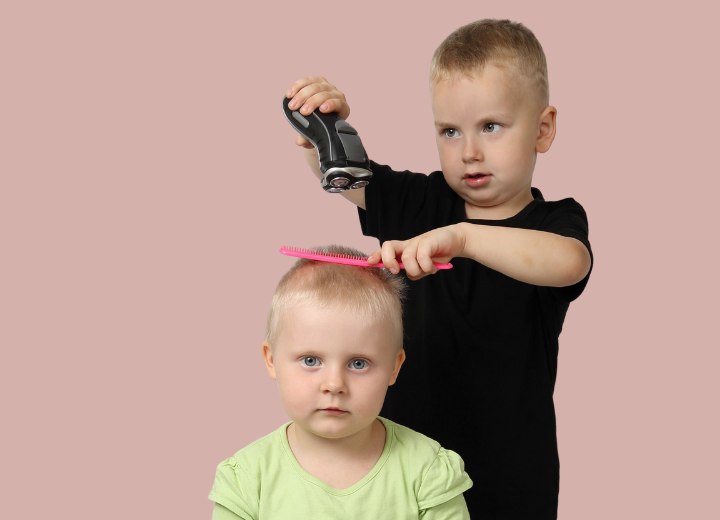 Kid with an electric shaver