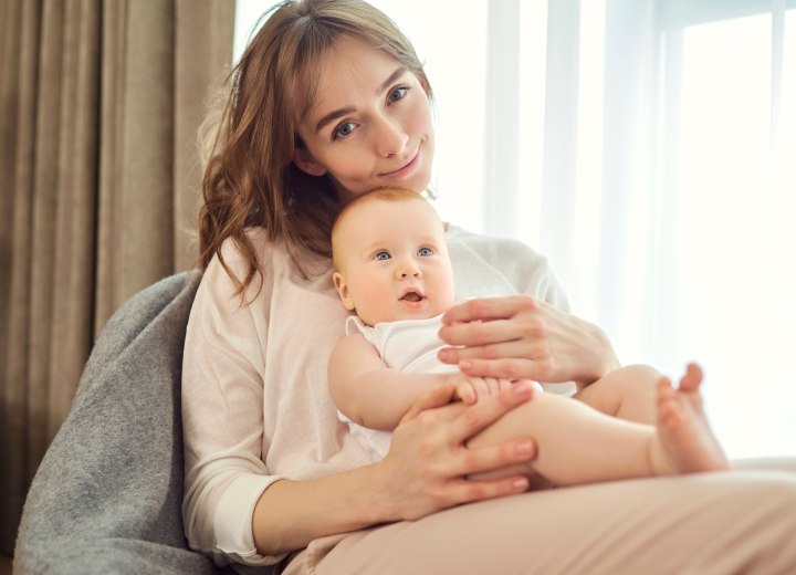 Mother with long hair and her child