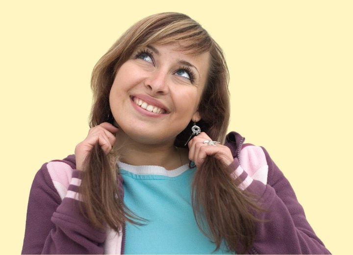 Girl pulling her own hair to make it grow faster