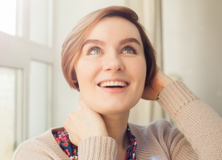 Woman with shorter than chin length short hair