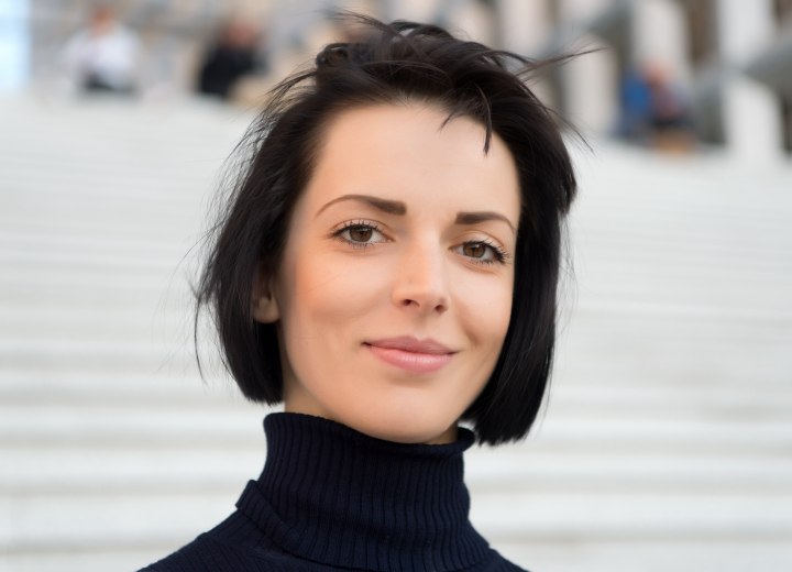 Bob cut and a turtleneck to make the hair look longer