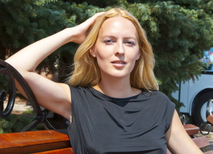 Woman enjoying the sun shining on her hair