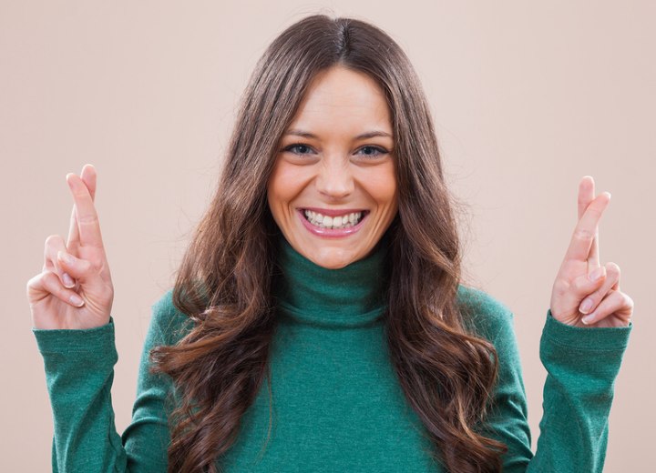 Woman wearing a turtleneck before her long to short hair makeover