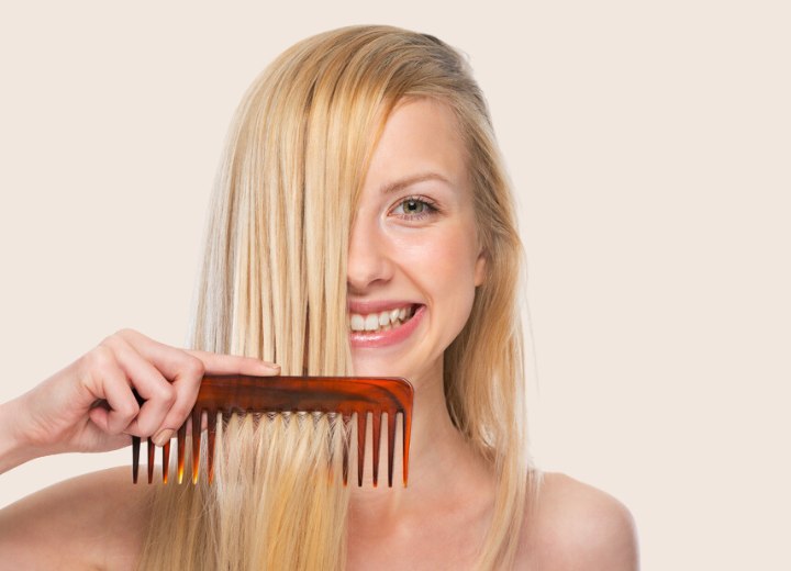 Combing hair with a wide tooth comb