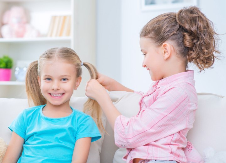 Girls doing each others hair