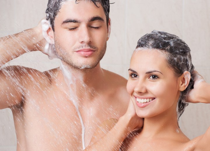 Man and woman washing their hair with the same shampoo